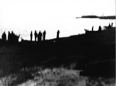 ombre di uomini sulla spiaggia